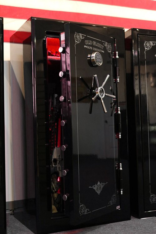 60 inch tall by 30 inch wide Old Glory Super Duty gun safe unlocked loaded in gloss black with red LED lighting