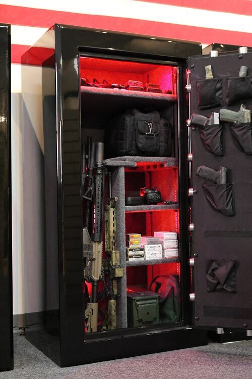 60 inch tall by 30 inch wide Old Glory Super Duty gun safe unlocked in gloss black with red LED lighting and door storage